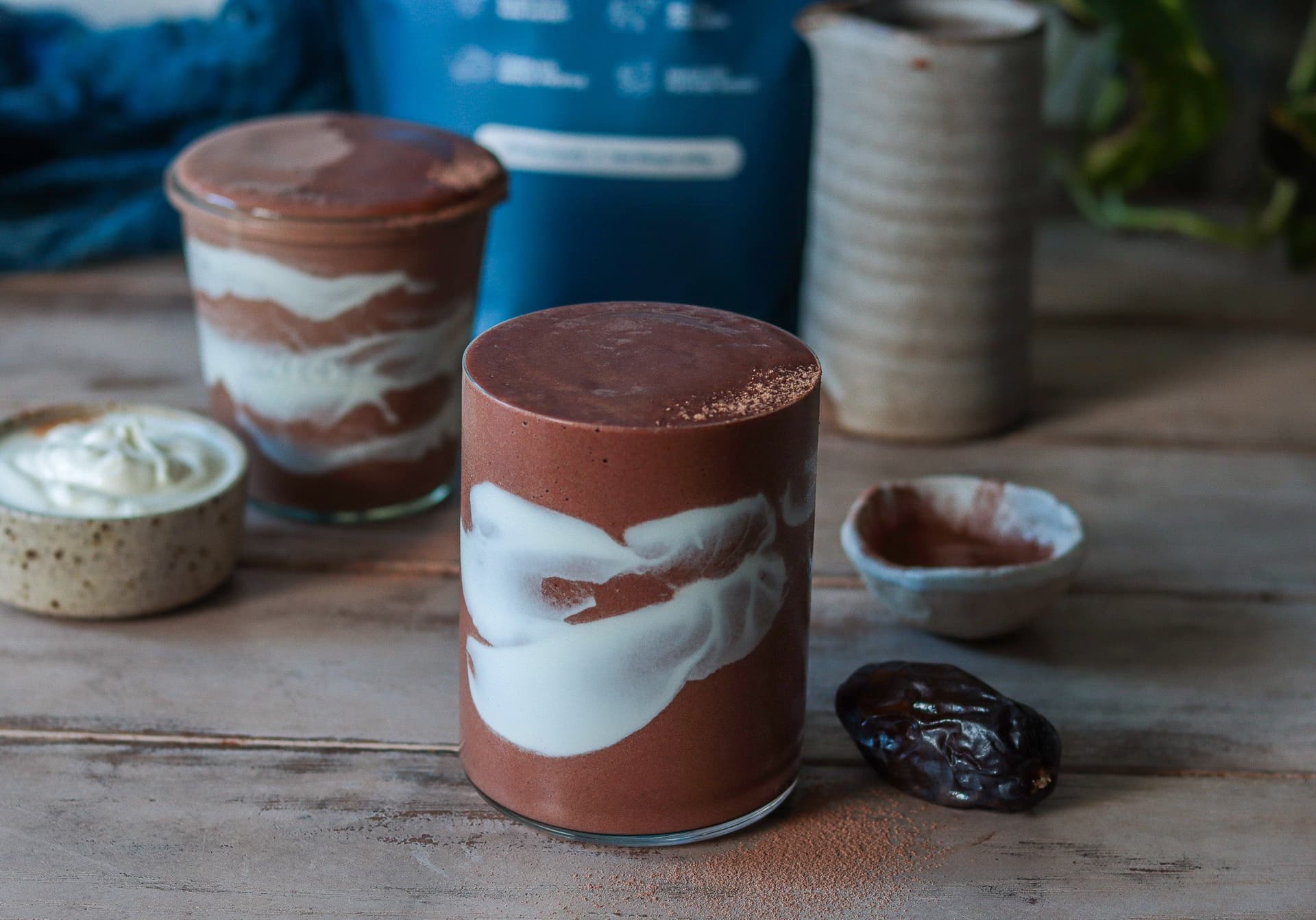 A chocolate collagen mocha smoothie swirled with cream
