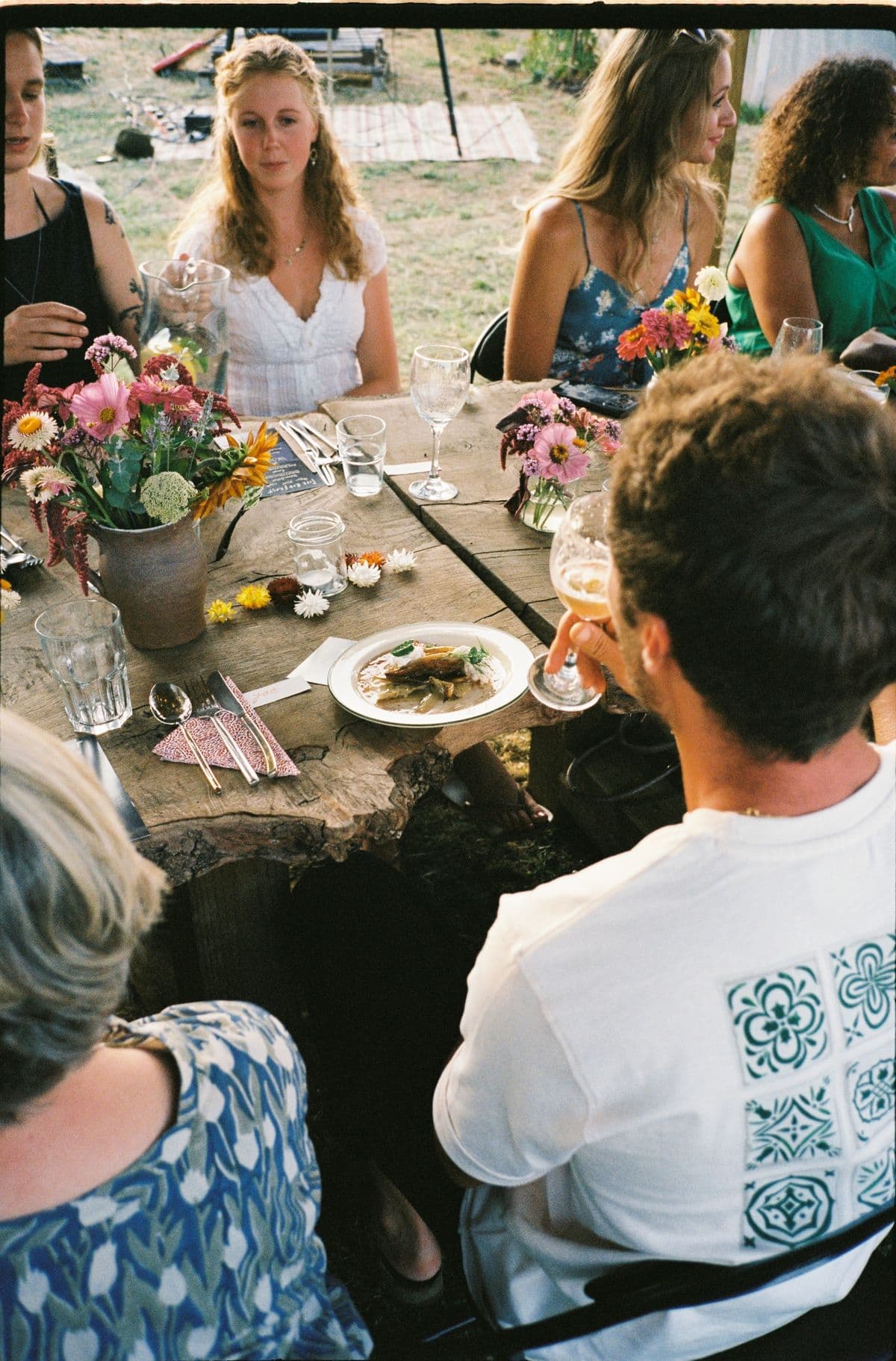 Guests mid evening at the long table