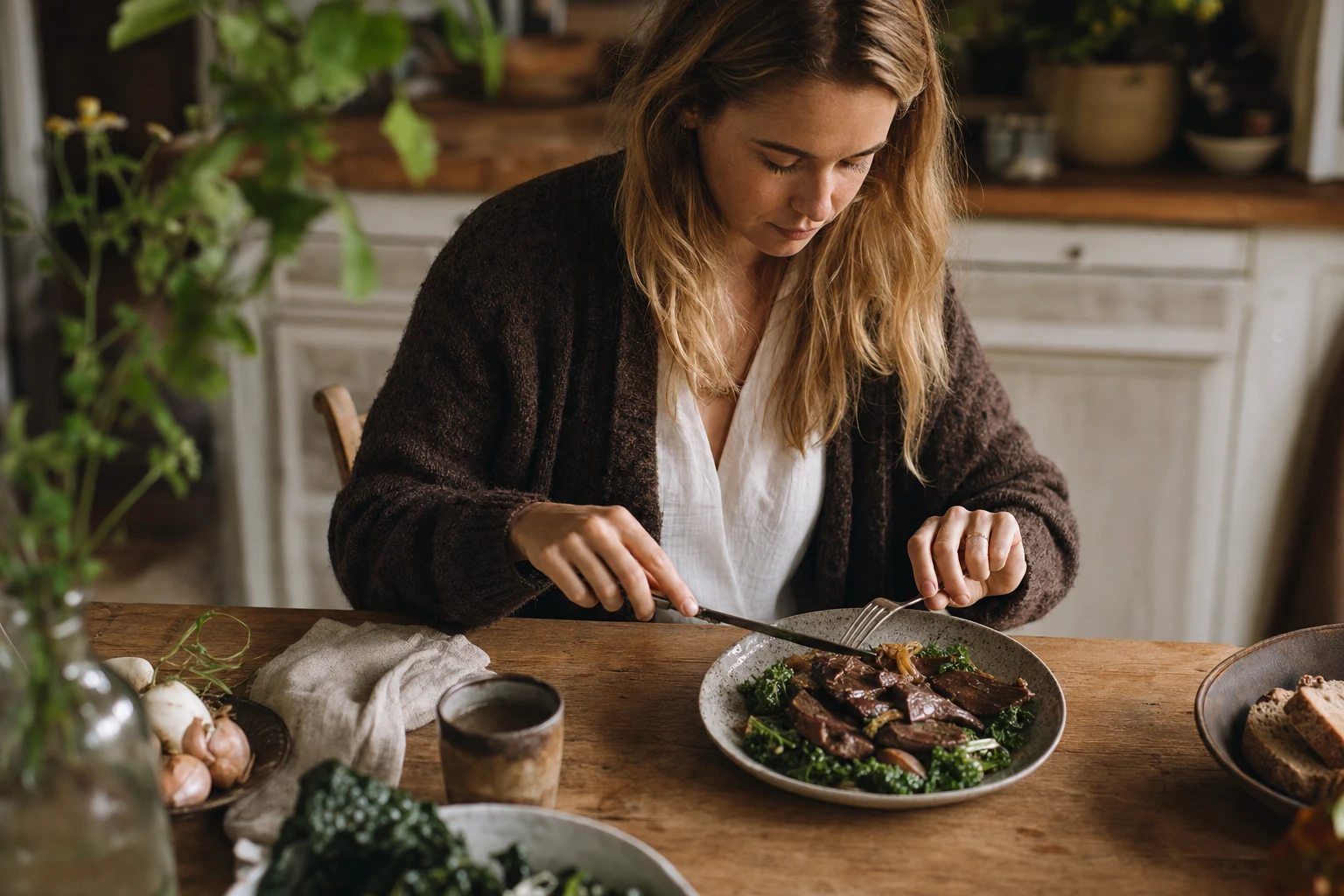 Modern person eating organ meat or nose-to-tail dish
