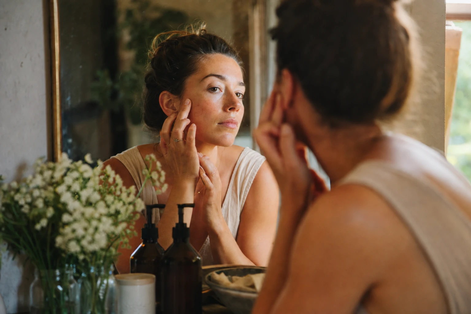 Split screen showing youthful skin vs aged, damaged skin