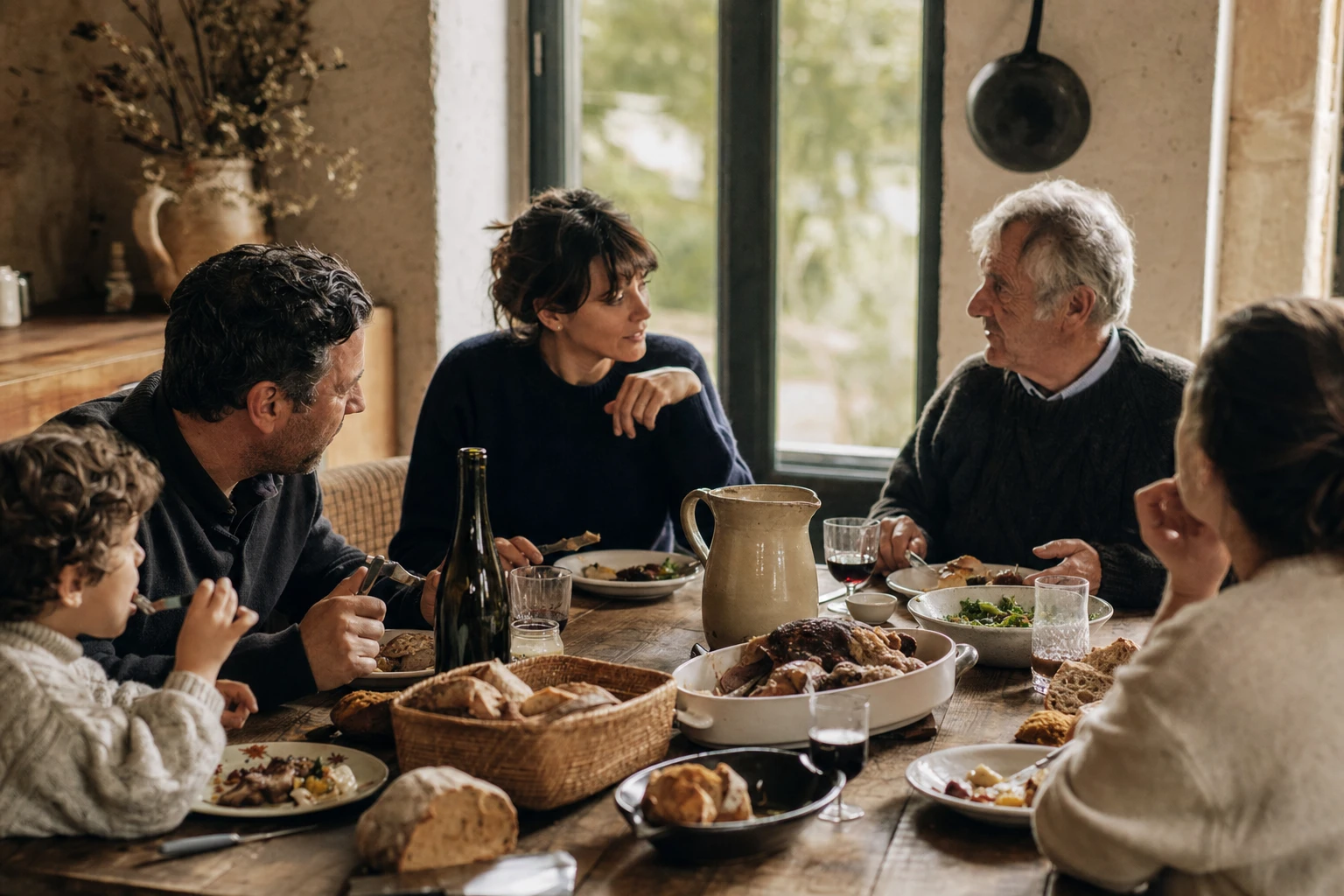 A French family sharing a meal together, focused and engaged